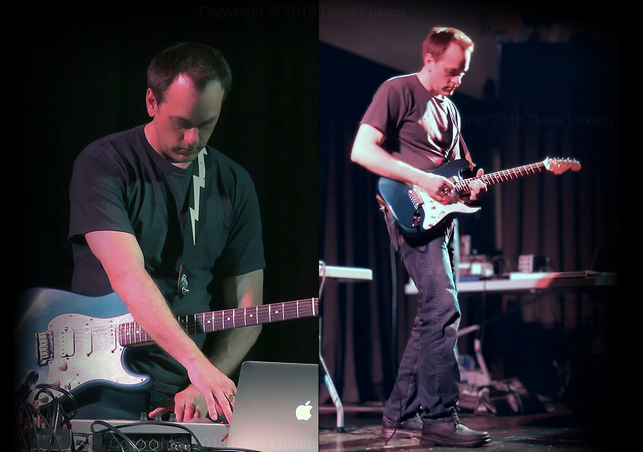 Dave Luxton playing guitar in concert
